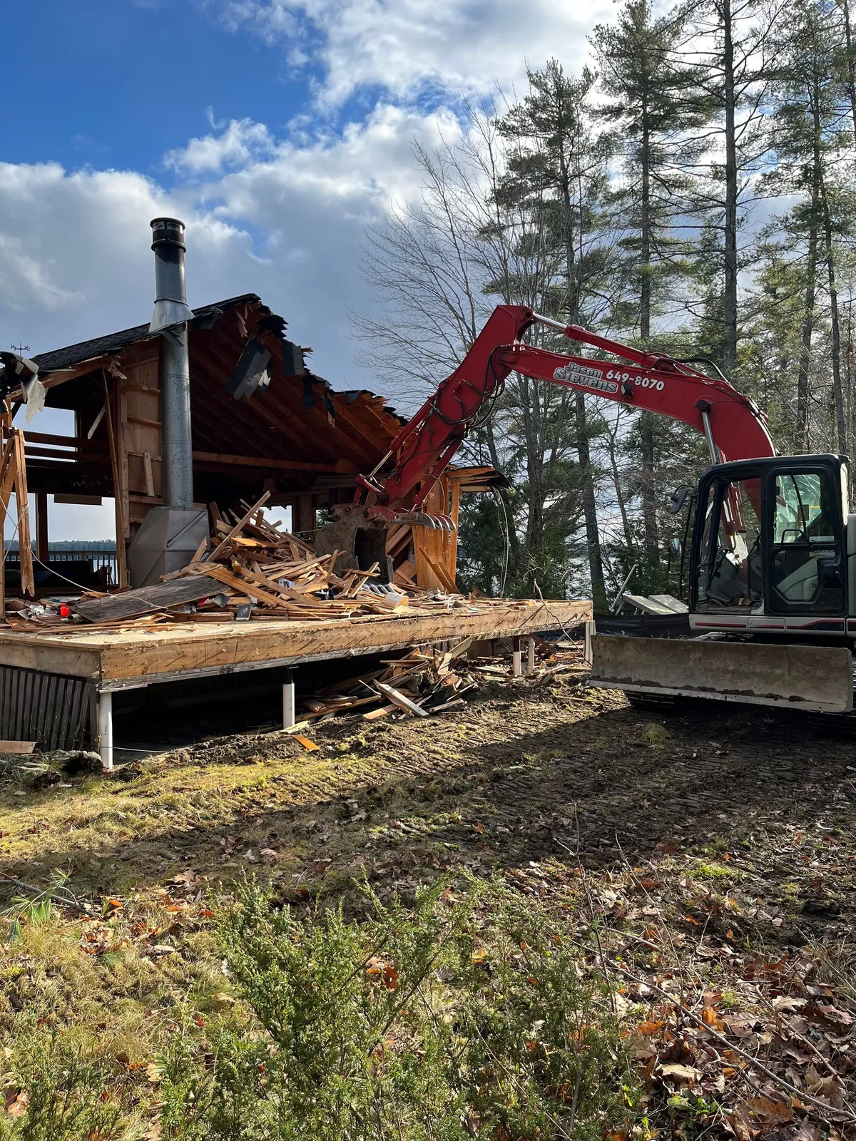 Excavation equipment working at a structure demolition site.